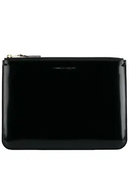 Comme des Garçons logo-debossed leather clutch bag 11583257